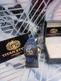 Luxury watch with blue strap and colorful face on a marble surface with Titan Style branding.